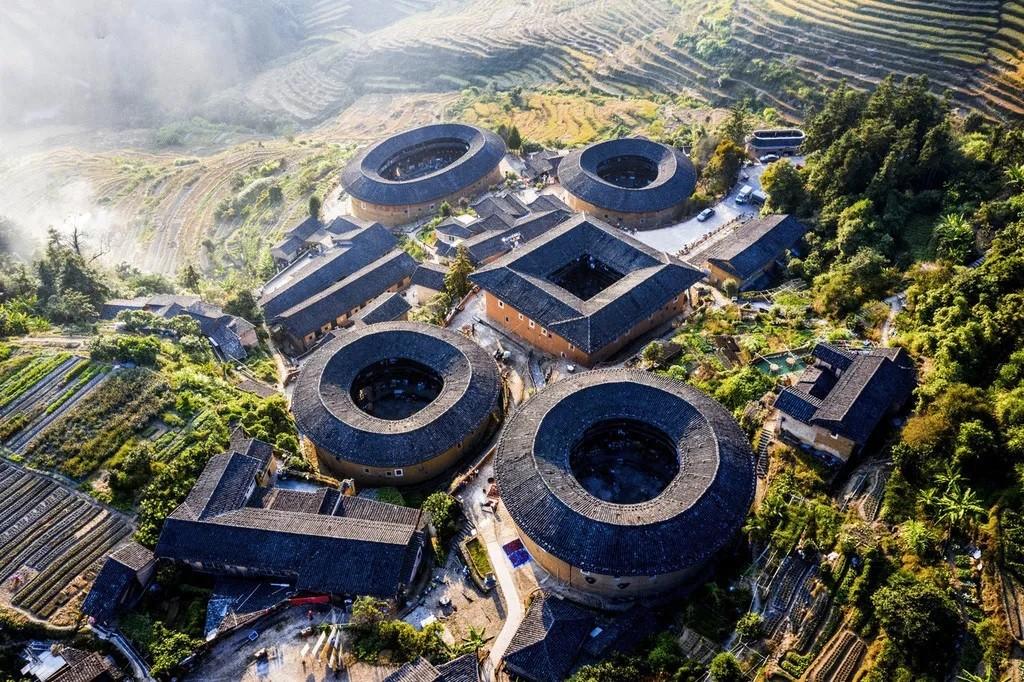 Tianluokeng Tulou Cluster in Fujian surrounded by green mountain countryside