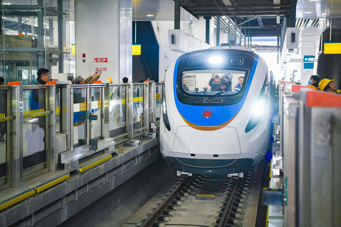 Modern metro train arriving at a subway station in China
