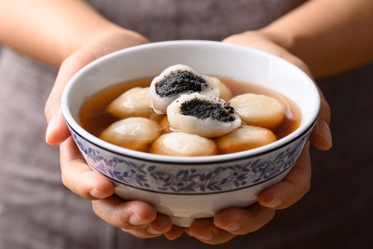 Chinese tangyuan glutinous rice balls filled with black sesame in sweet soup